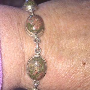 Moss green stones set in marked 925 Sterling